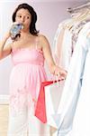 Pregnant woman shopping, drinking water, looking at dresses