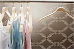Clothes rail with coat-hangers and dresses