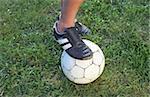 Foot of a Boy on a Leather-Football - Leisure Time Sports - Meadow