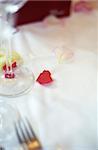 Menu Card on a Table with Rose Petals on it - Decoration - Party - Wedding