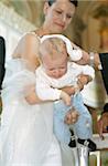 Baby on the Arm of a Bride is getting baptized - Baptism - Wedding - Church - Tradition - Christianity