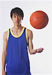 Chinese young man with basketball