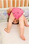 Baby Girl Playing in Crib