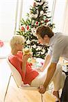 Couple Exchanging Gifts on Christmas Morning