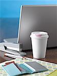 Coffee Cup, Laptop Computer and Office Supplies on Desk