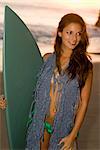 Woman with Surfboard on Beach, Malibu Beach, California, USA