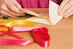 Close-up of Woman Putting Birthday Card in an Envelope