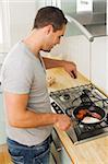 Man cooking fried breakfast