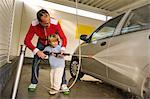 Father and Son Washing the Car at the Car wash