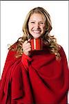 young woman holding a red mug.