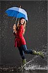 young woman holding an umbrella.