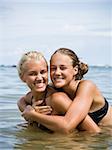 two young woman in the ocean