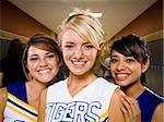 Three High School cheer leaders.
