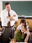 Student and teacher in a classroom.