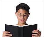 Boy reading a book.