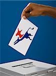 hand casting a ballot.