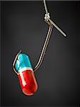 Pill on a fish hook.