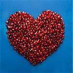 pomegranate seeds shaped into a heart