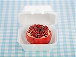 pomegranate in a fast food container