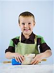 boy kneading dough