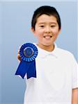 boy with a blue ribbon