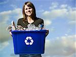 woman holding recycling bin