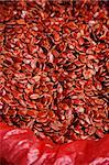 Still life of red melon seeds at market