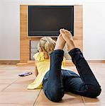 Young girl watching television