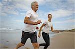 Couple running on a beach