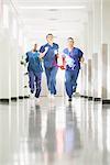 Three medical staff running