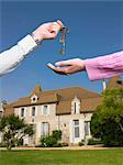 Woman receiving keys to country home