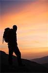 Hiker looking at the sunrise.