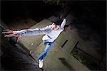 Man Practicing Parkour in city, Portland, Oregon, USA