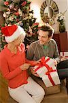 Couple Exchanging Gifts on Christmas Morning