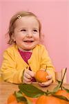 Girl Holding Orange