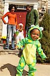 Portrait of Boys Trick-or-Treating with Parents