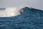 Surfer Riding Tube at Chickens Surf Break, North Male Atoll, Maldives