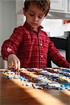 Boy Playing With Puzzle