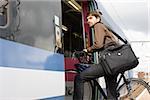 Man with bike getting onto train