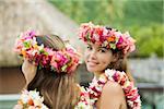 Young women with flowers in hair in moorea