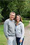 Mature couple wearing tracksuits