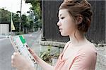 Young woman looking at map