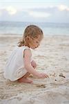 Little Girl Looking for Shells in Sand, Cancun, Mexico