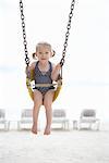 Girl Wearing Bathing Suit in Swing on Beach, Cancun, Mexico