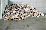 Paper and cardboard piled up in recycling center