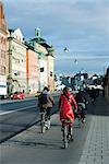Sweden, Sodermanland, Stockholm, bicyclists riding on sidewalk