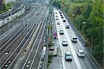 Sweden, Sodermanland, Stockholm, train tracks and street side by side