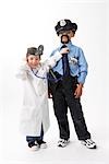 Girl Dressed as Doctor Checking Boy Dressed as Police Officer