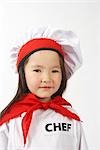 Little Girl Dressed Up as a Chef