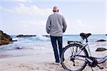 Man With Bicycle on the Beach